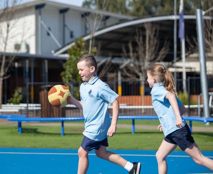 Students playing basketball