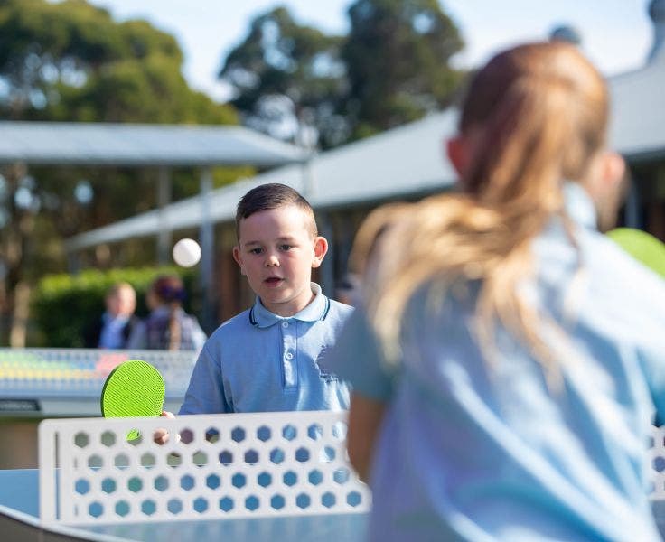 Students playing table tennis